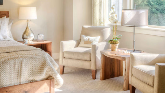 A bright white bedroom styled with minimalist decor, soft linens, and a subtle bedroom fragrance creating a clean, serene atmosphere