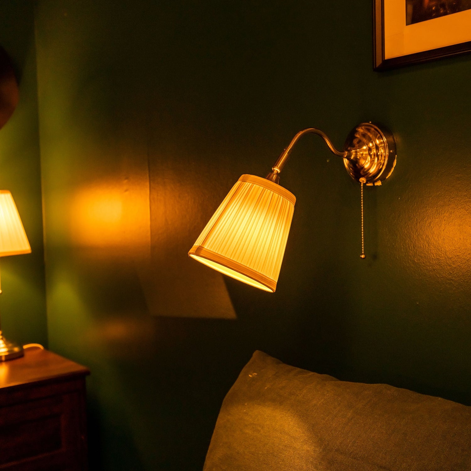 Warm bedroom lamp casting a soft glow, creating a relaxing and cozy atmosphere