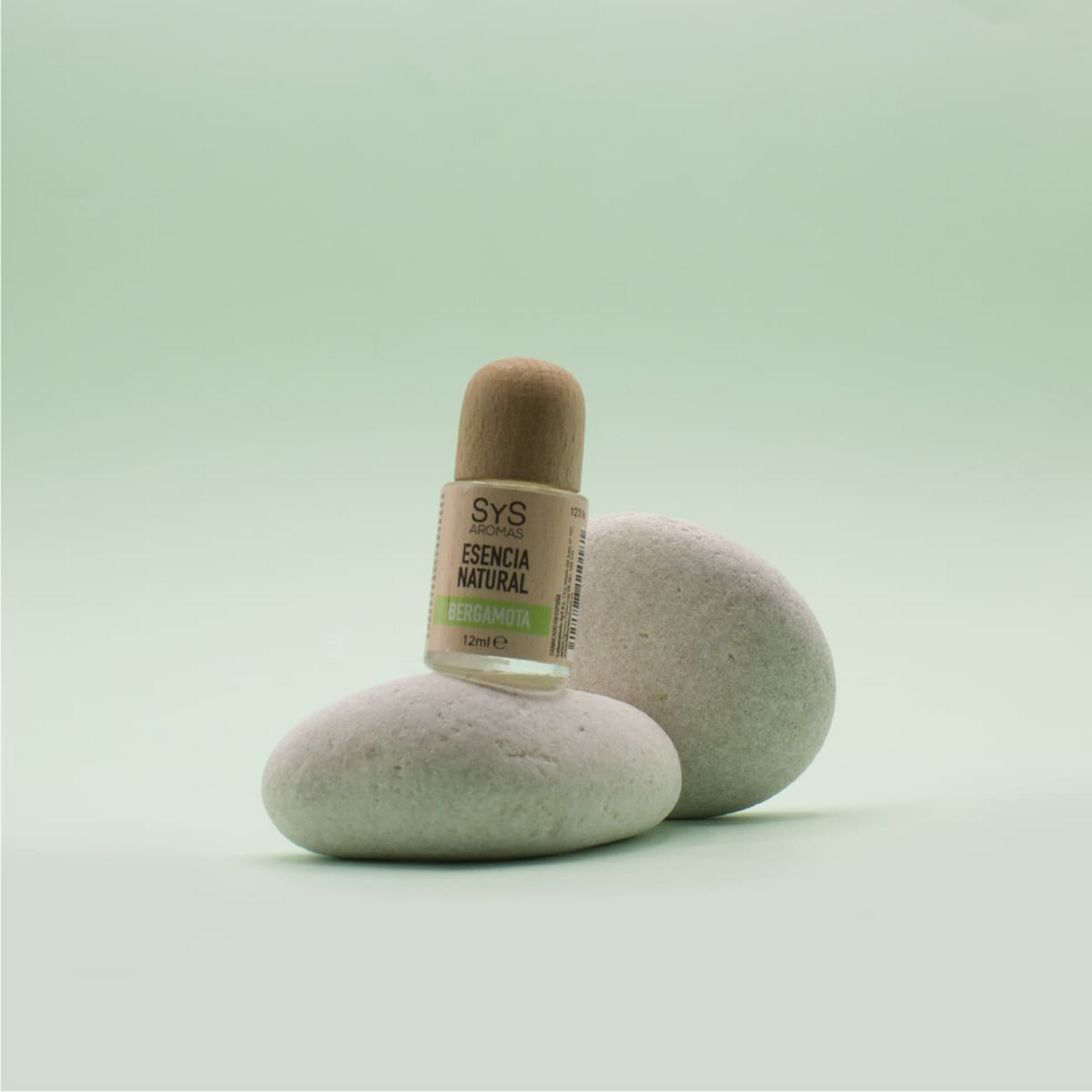 Bergamot Essence 12ml styled on  smooth zen rocks