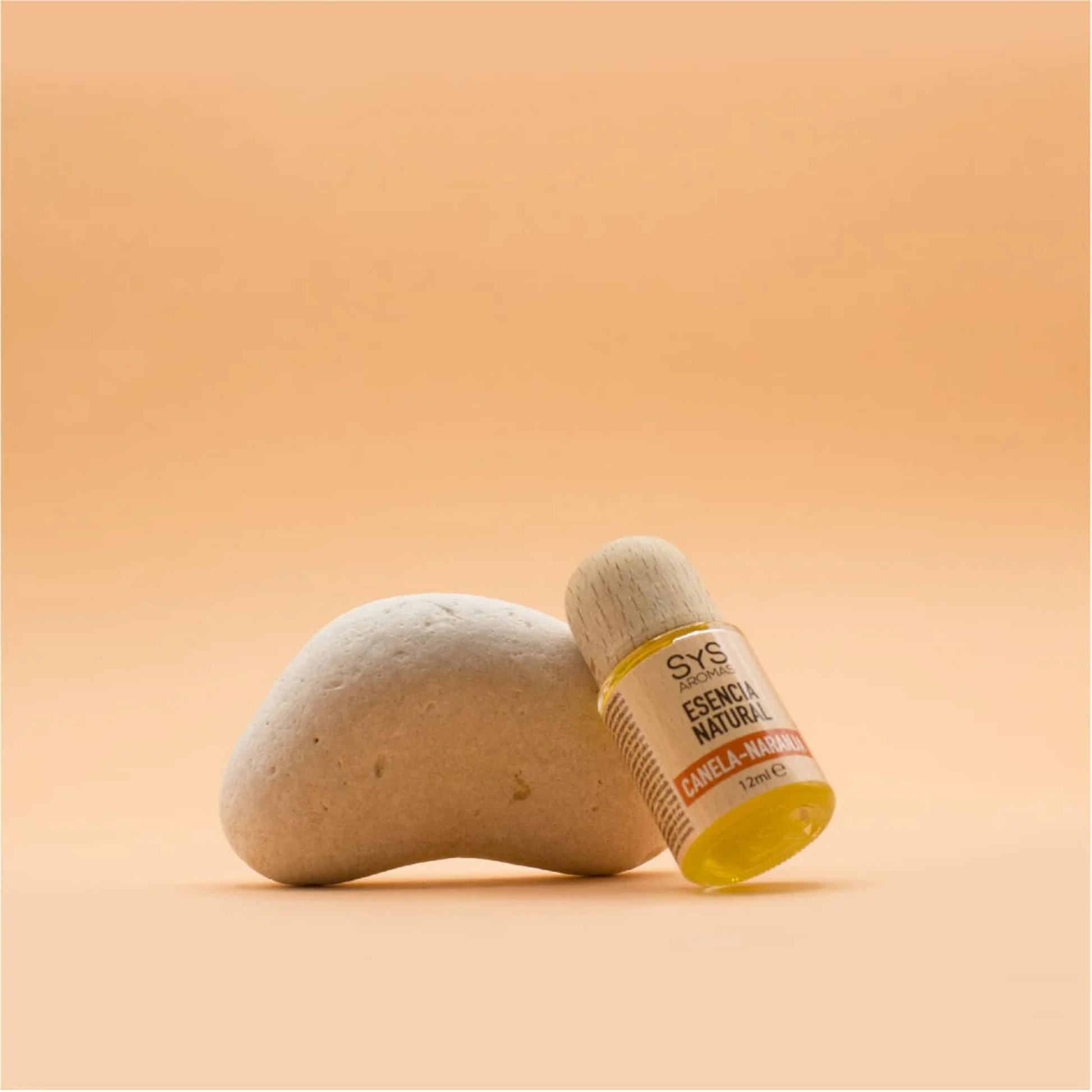 cinnamon orange essence 12ml styled on white sooth zen rock
