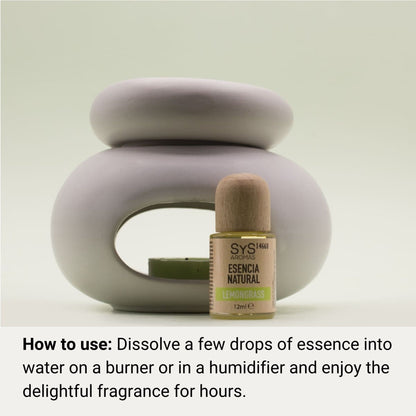 Aromatherapy diffuser and lemongrass essential oil bottle with text that reads 'natural essence' on a light background and text that reads 'How to Use: Dissolve a few drops of essence into water on a burner or in a humidifierand enjoy the delightful fragrance for hours'.