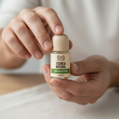 Person holding a bottle of SYS Aromas eucalyptus essential oil
