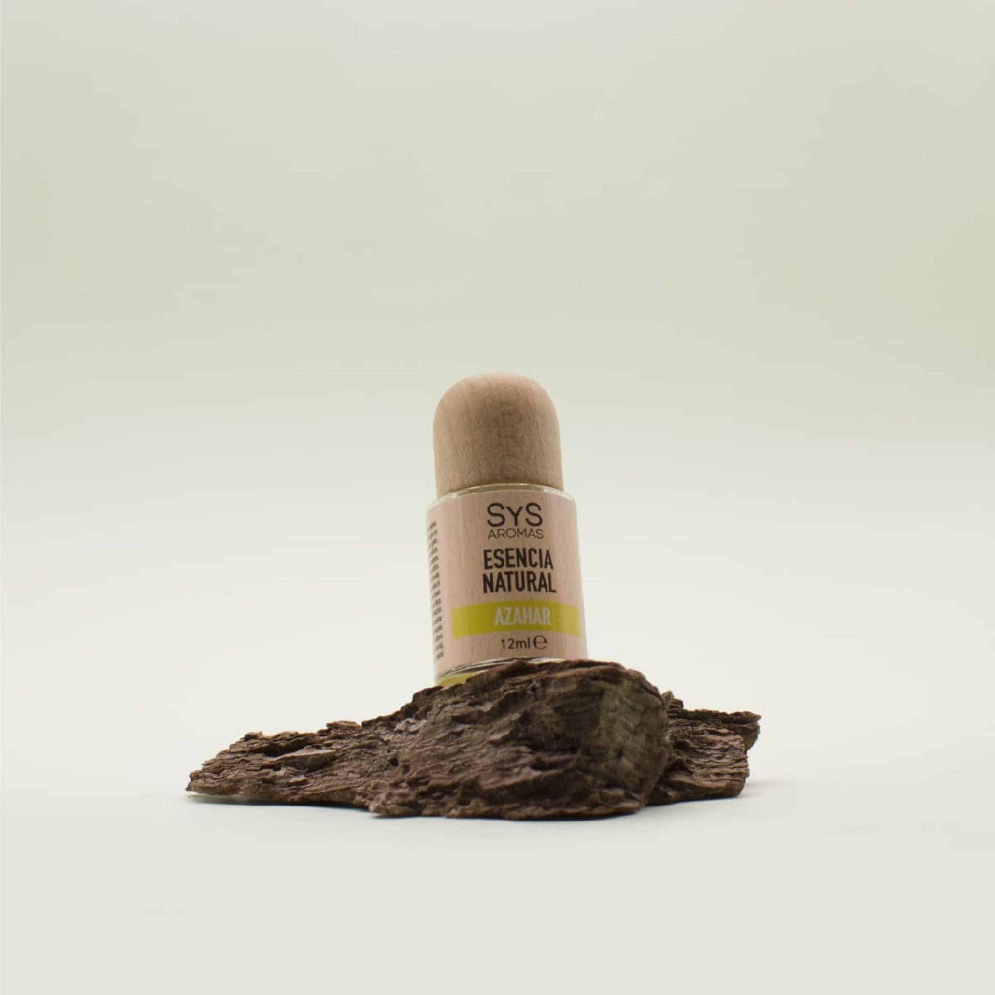 Bottle labeled 'SYS Aromas Orange Blossom' on a natural wood background