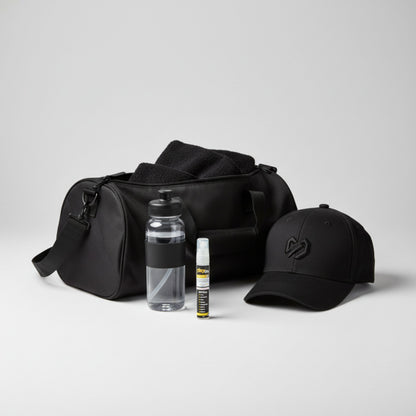 Black duffel bag with a cap, water bottle, and playon spray mini n a white background.