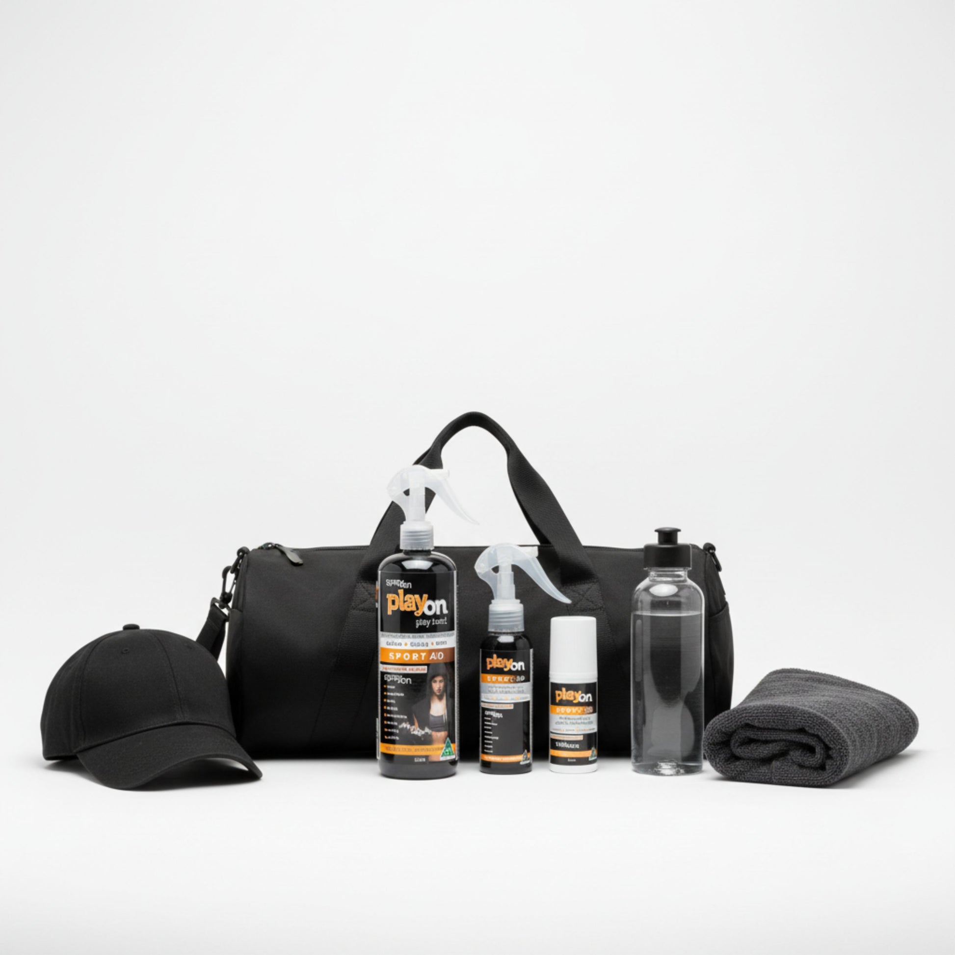 Black duffel bag with a cap, bottles, playon refill, playon spray and playon roll on on a white background.