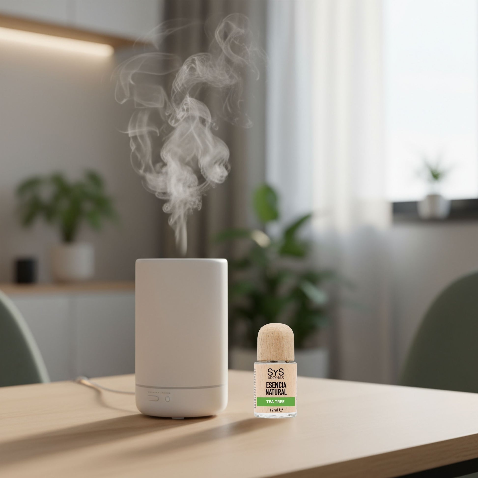 White diffuser with steam and a bottle tea tree oil 12ml on a table in a room with plants and furniture.